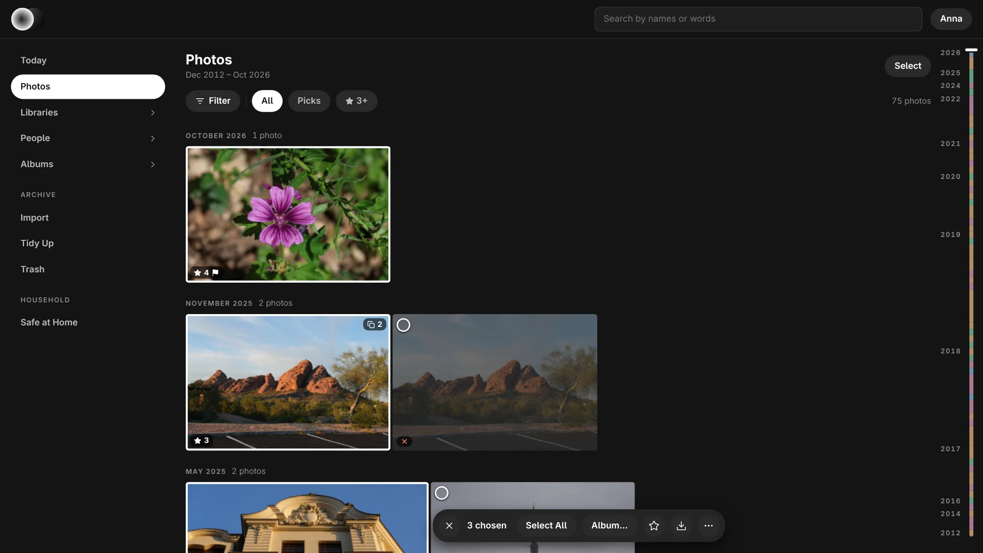 Three photographs chosen on the Photos page, each in a white frame, and the bar for them: the count with Select All, Album…, the star for stars and the flag, Download and More