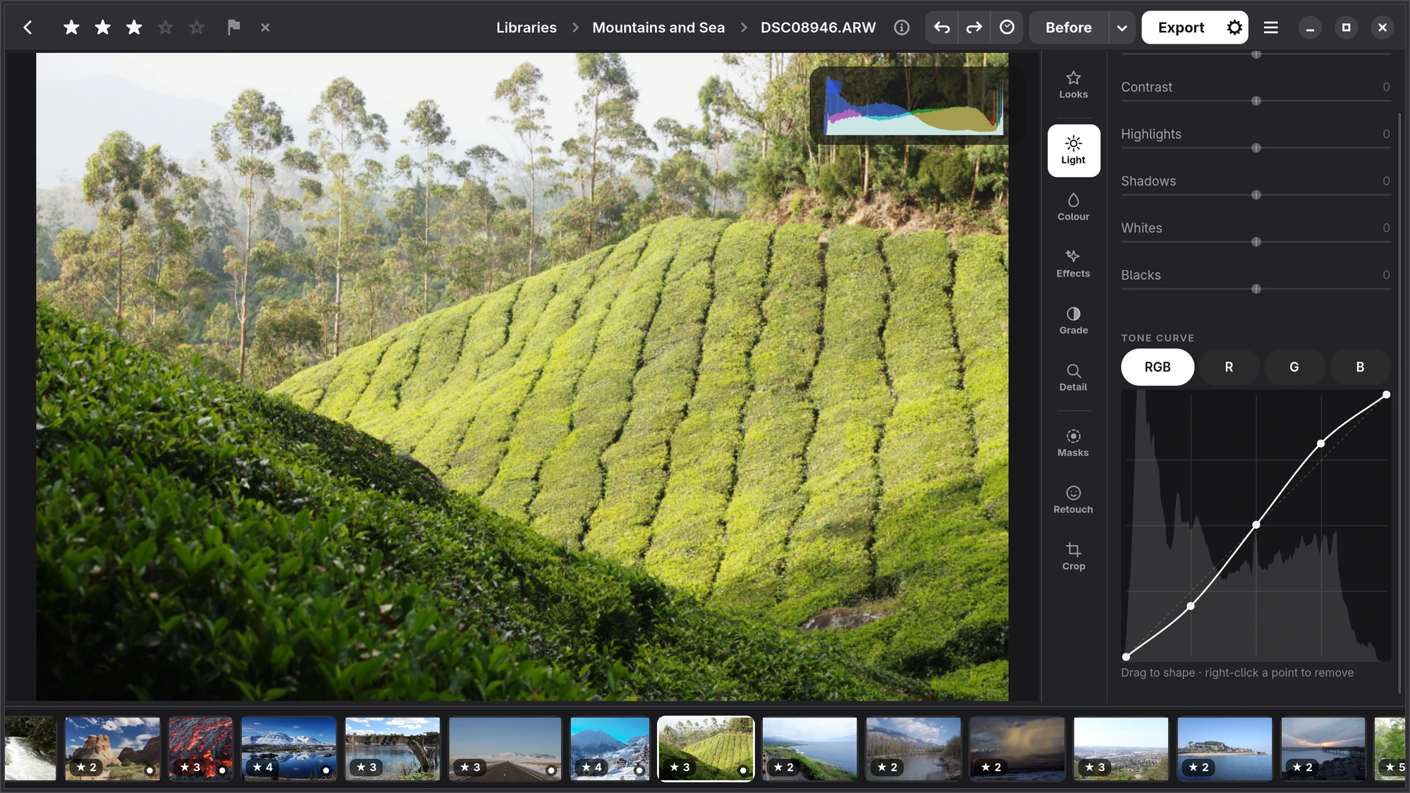 A tone curve with three points over the histogram, on a photograph of a hillside tea plantation