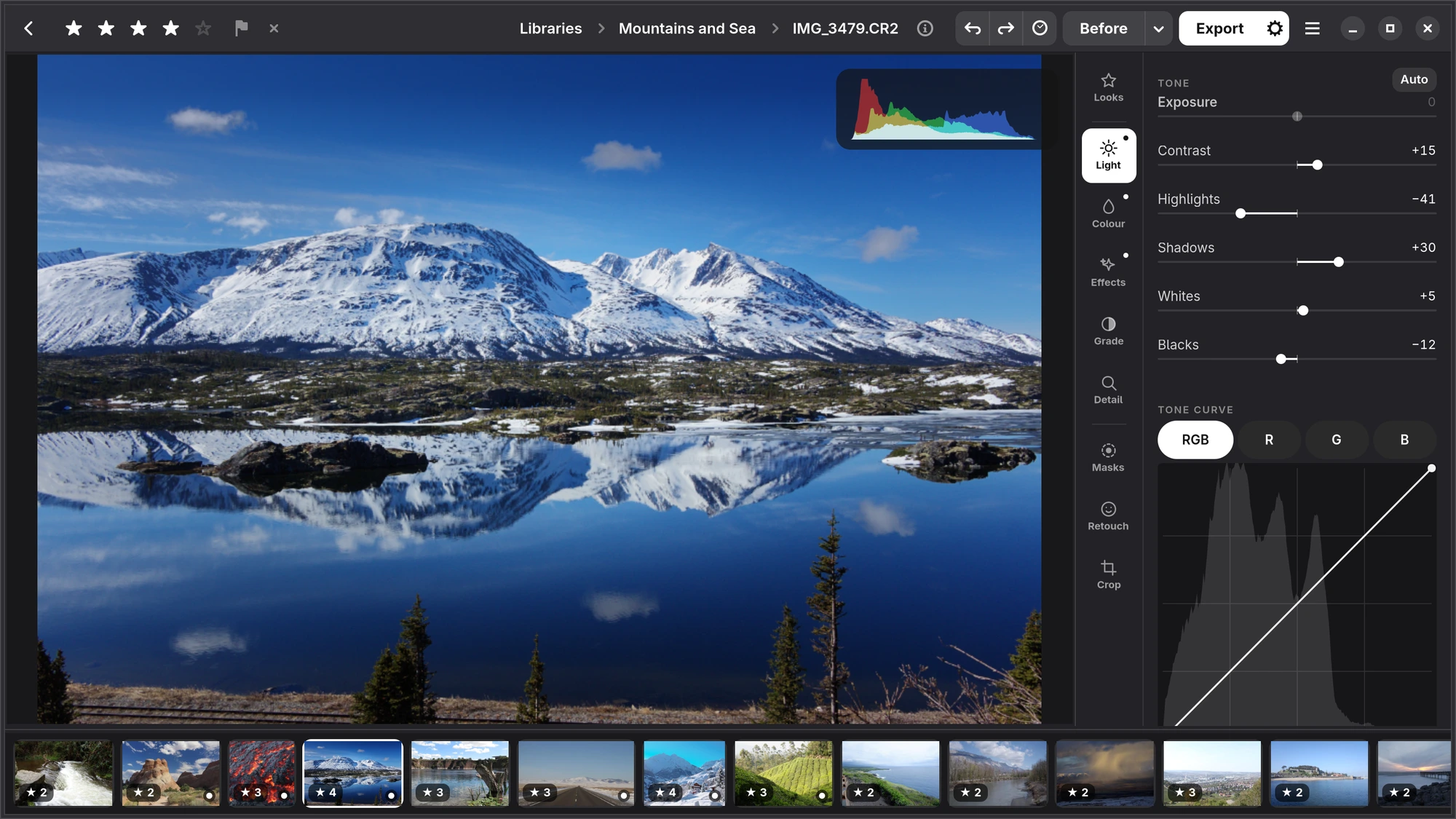 The editor on Linux: the bar with the stars at the left, the path in the middle and Undo, Redo, History, Before and Export at the right; the photograph with the histogram at its top right; the panel with its rail of tabs; the filmstrip below