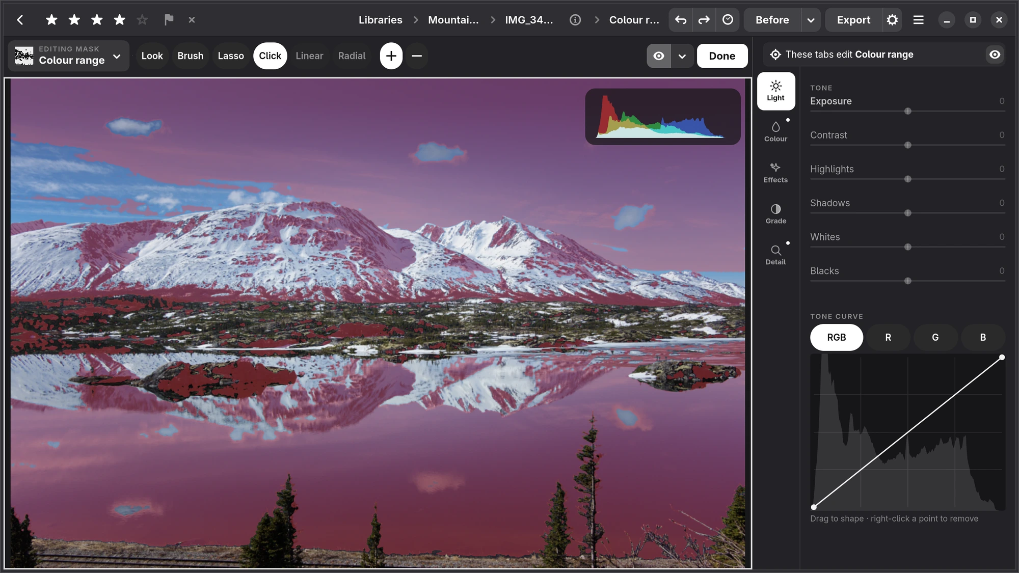 A colour range mask on the blue of a mountain lake, washed red, under the mask bar with Click in hand and + chosen
