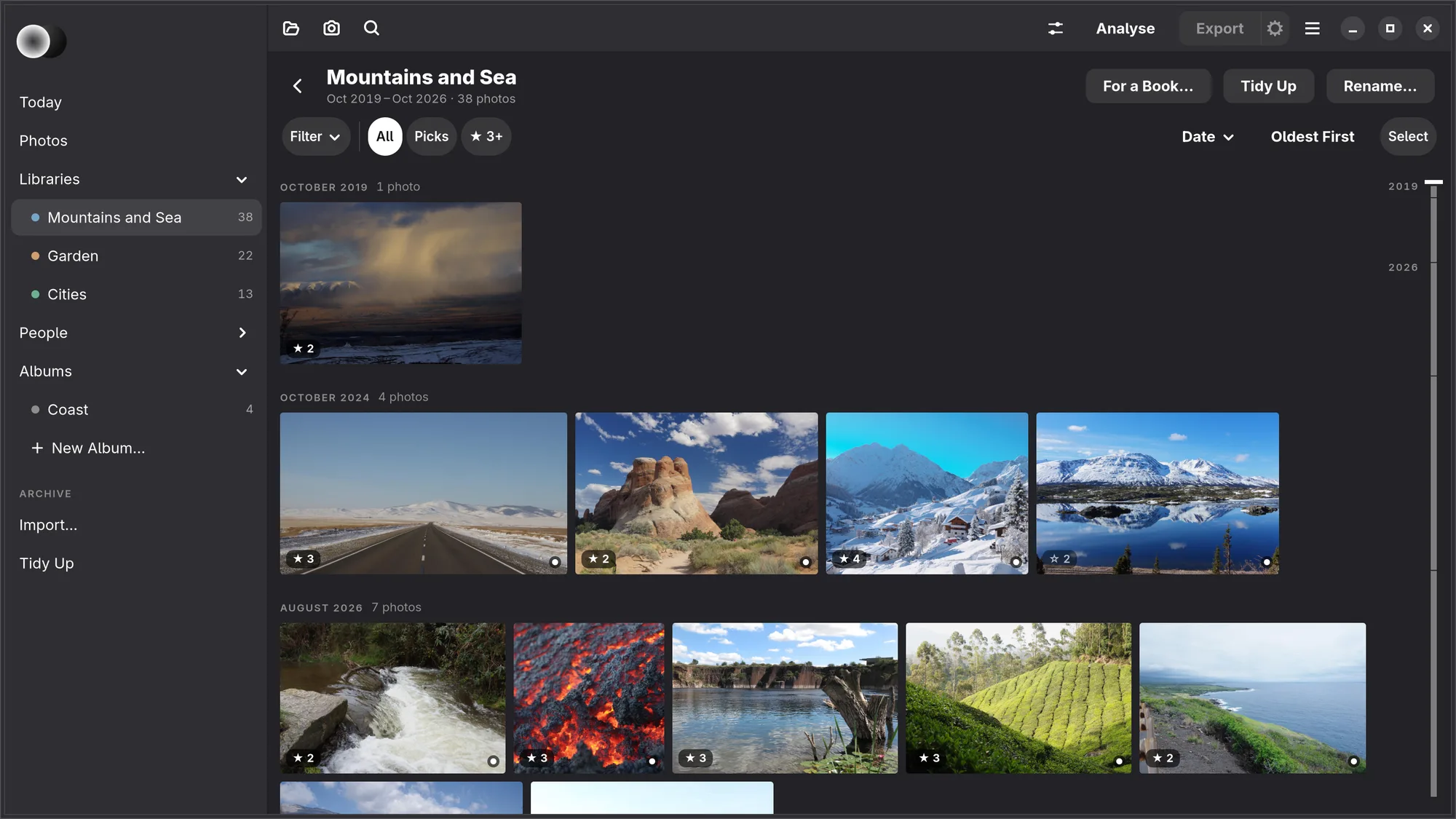 Mountains and Sea open: in the side list the library chosen under Libraries, with Garden and Cities, each with its colour and count, and the album Coast; above the grid the way back, Mountains and Sea, Oct 2019 – Oct 2026 · 38 photos, For a Book…, Tidy Up and Rename…