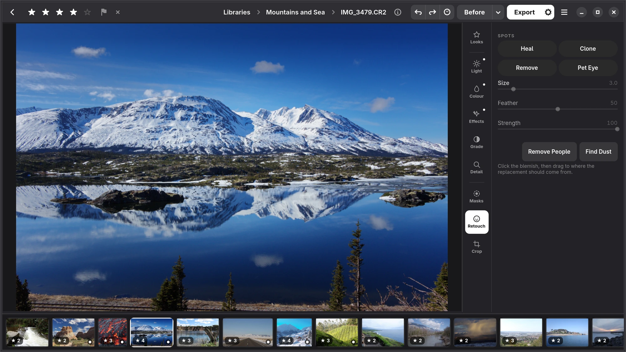The Retouch tab with Heal, Clone, Remove and Pet Eye, and a few spots on the photograph
